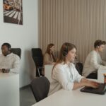four people working in call center office