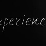 experience lettering text on black background