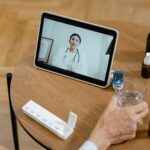 high angle shot of a person making a zoom call to a doctor