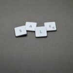 four white sale boards