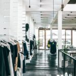 fashion store interior with garments hanging on racks