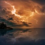 blue body of water with orange thunder