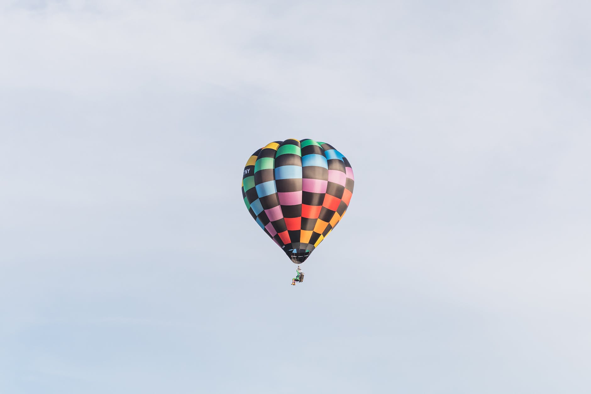 checkered hopper balloon in the blue sky