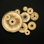 photo of golden cogwheel on black background