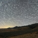 lights on night sky over wasteland
