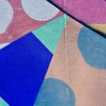 colorful shapes and patterns painted on flat surface