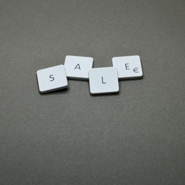 four white sale boards