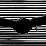 monochrome photography of people shaking hands