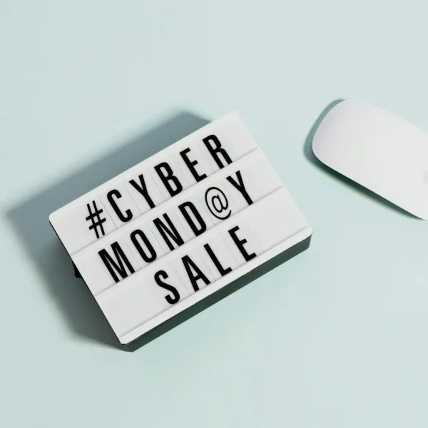cyber monday sale sign beside a computer mouse