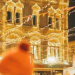 festive night market with illuminated historic building