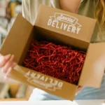 a box with red packing fillers