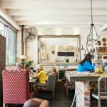 anonymous customers having break in cozy cafe