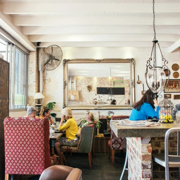 anonymous customers having break in cozy cafe