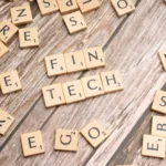 scrabble tiles spelling out the word fin tech